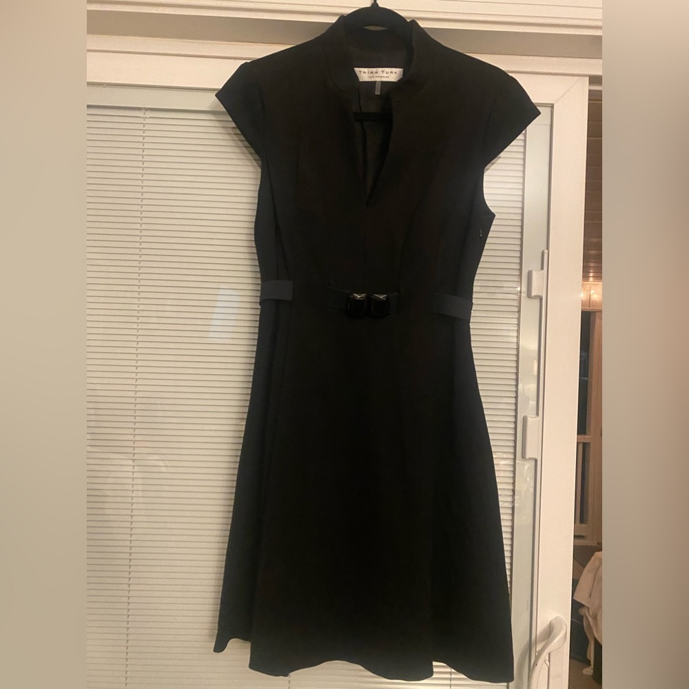 Trina Turk black dress, side zip, with belt at waist.